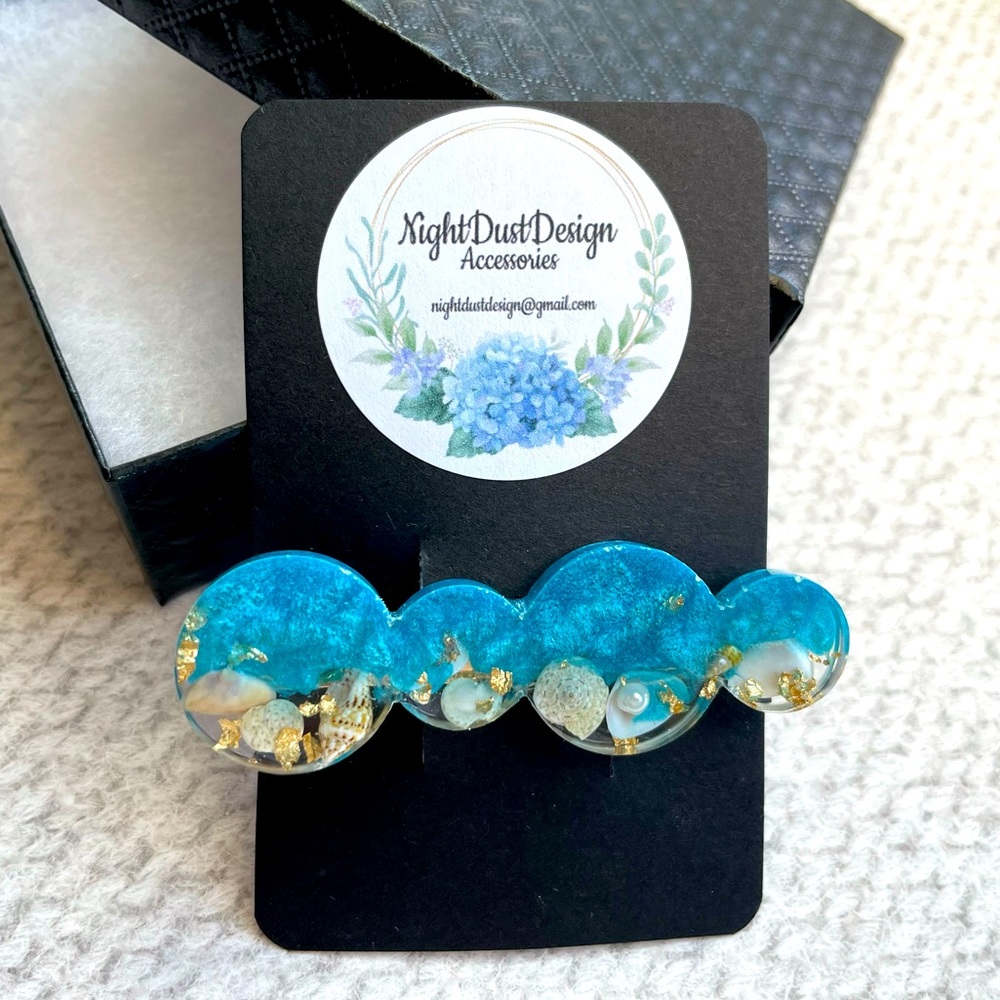 Handmade hair clip with seashells accents